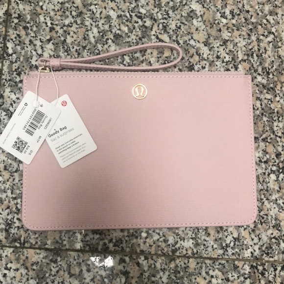 lululemon athletica Handbags - NWT Lululemon Light Pink “Goody Bag” wristlet